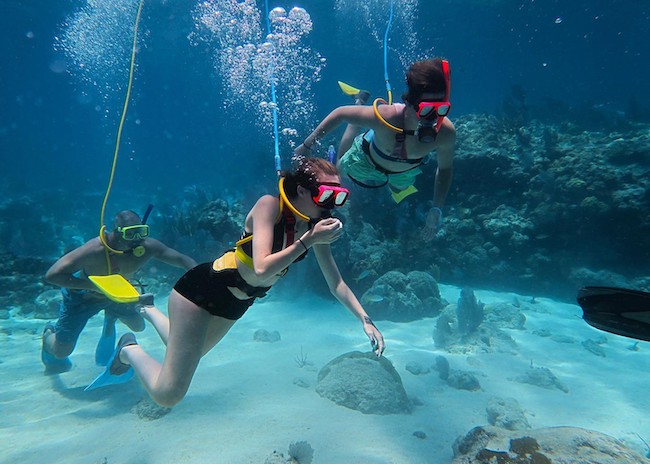 Susan and her brother seeing the wonders of the corals in Cozumel.